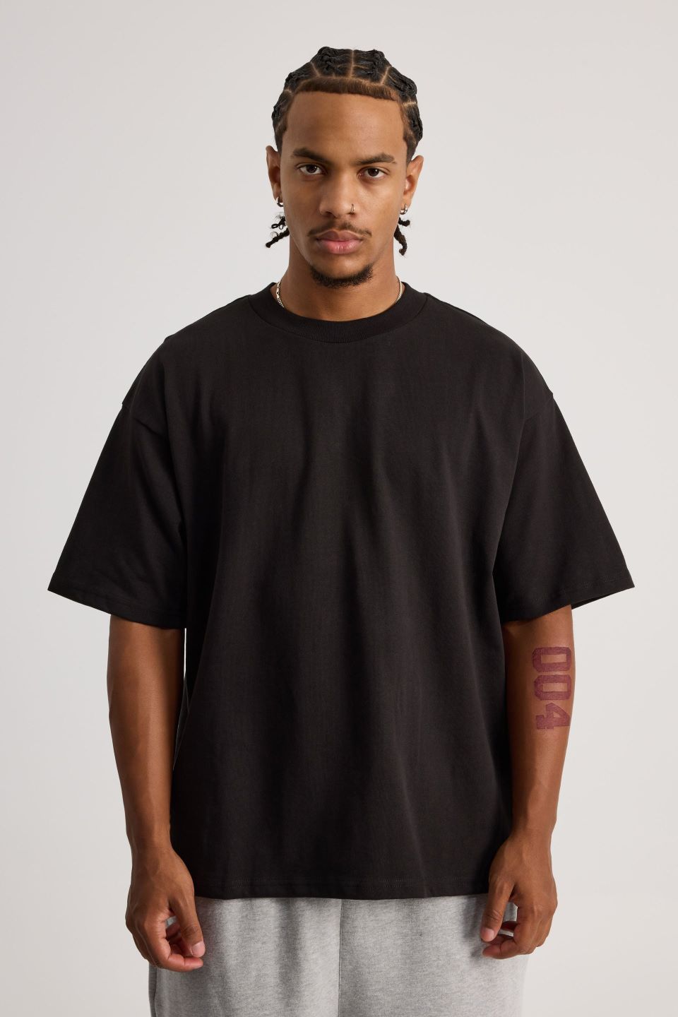 Person wearing a black graphic t-shirt